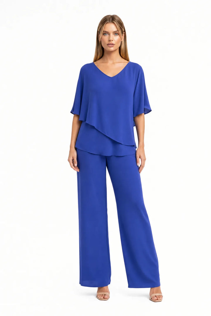 Blue flutter sleeve matching trouser set on model in contrapposto stance