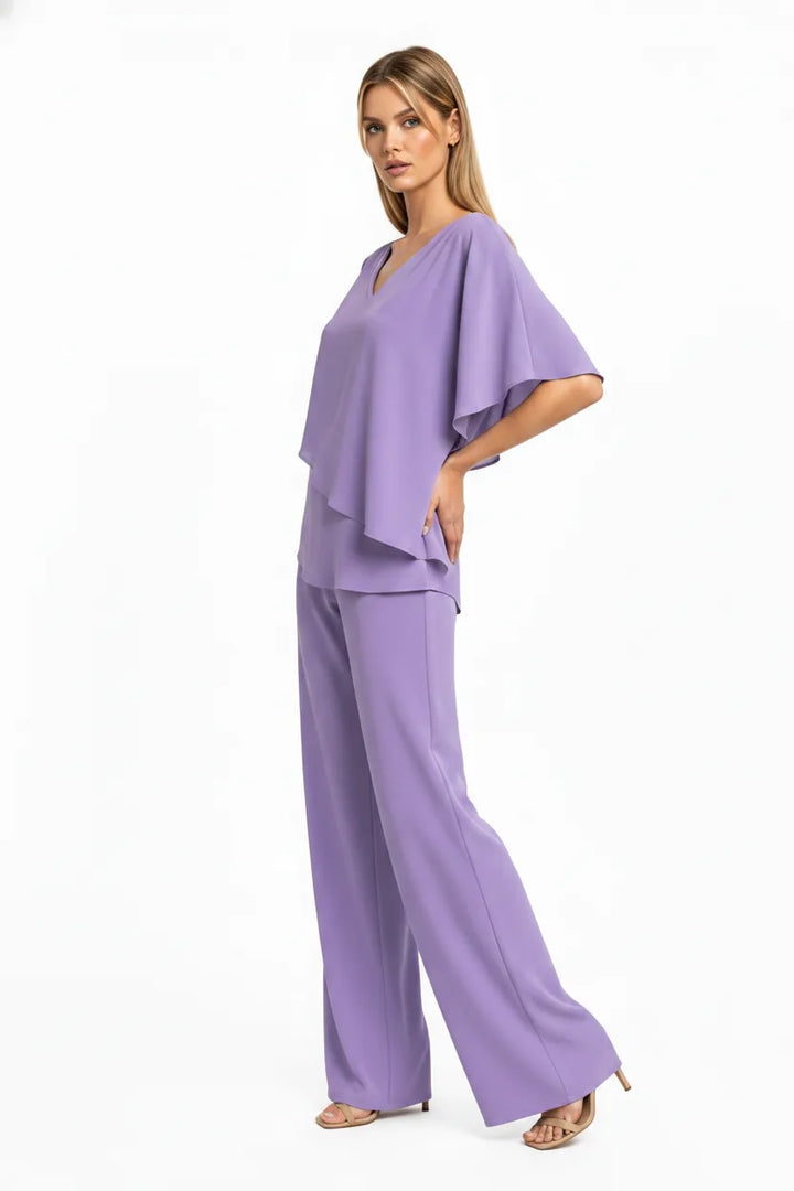 Purple flutter sleeve matching trouser set on model in three-quarter turn