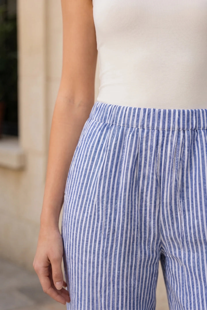 Close-up detail of blue striped tapered joggers