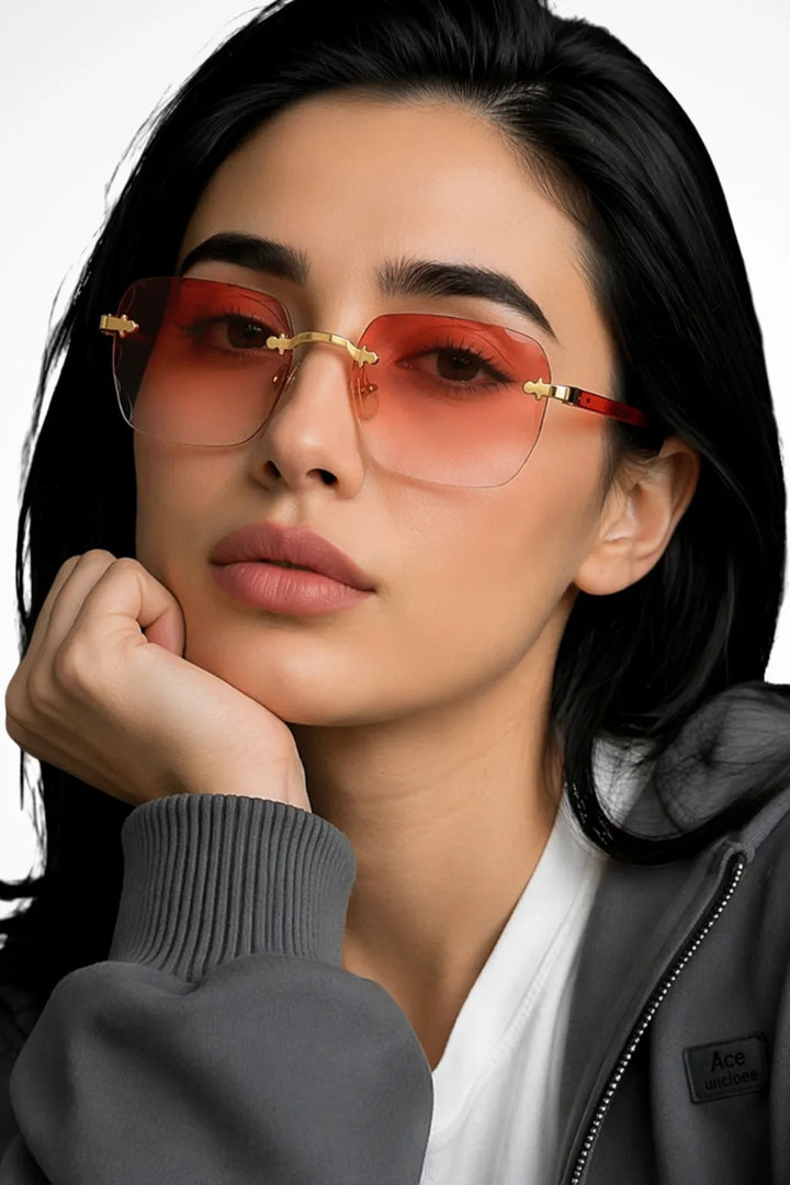 Square rimless sunglasses with peach coral gradient lenses, front view