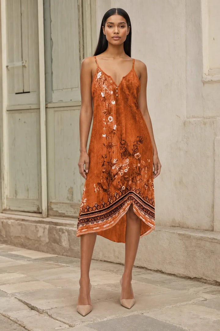 Orange floral boho shift dress on model in contrapposto stance