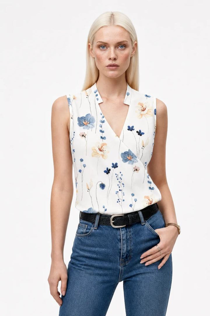Green floral collared wrap blouse on model in contrapposto stance