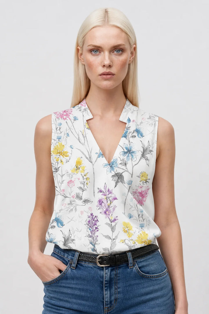 Pink floral collared wrap blouse on model in contrapposto stance
