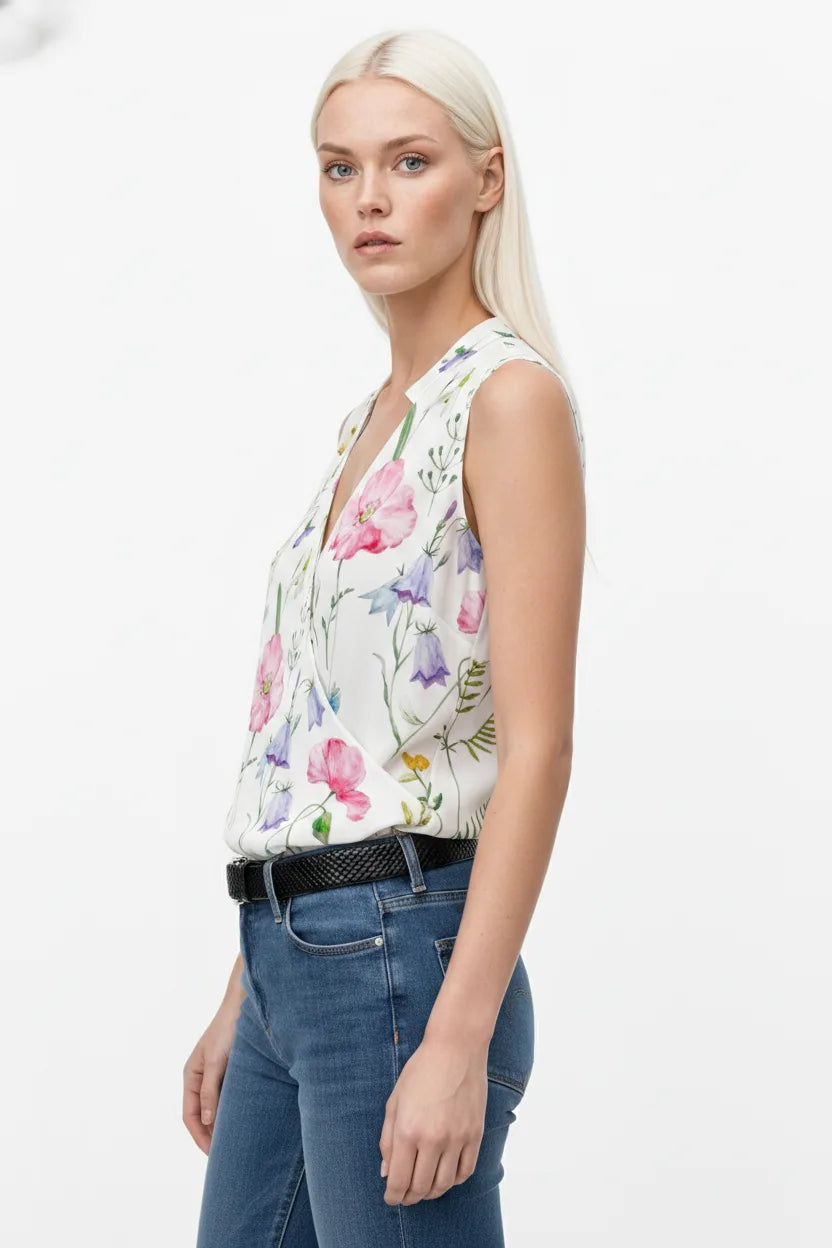 White collared wrap blouse on model in three-quarter turn