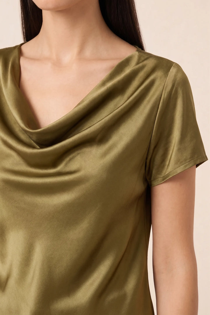 Close-up detail of gold satin cowl neck draping