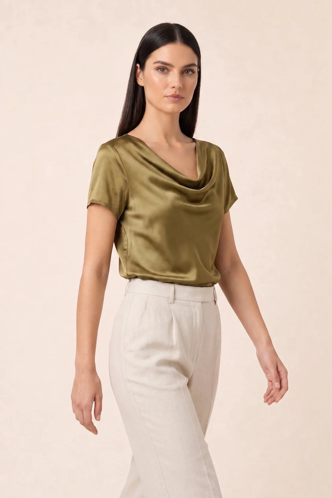 Gold satin cowl neck top on model in three-quarter turn