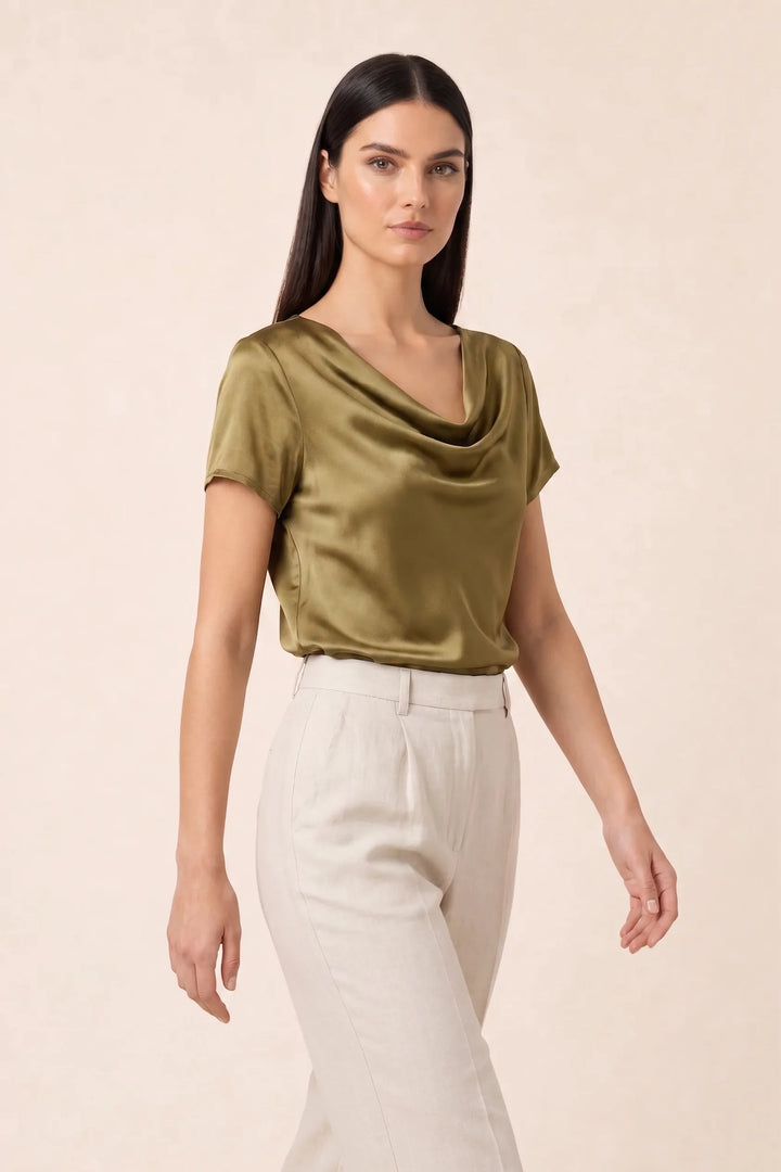 Gold satin cowl neck top on model in three-quarter turn