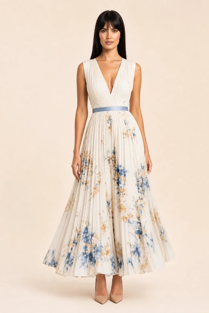 Beige pleated floral midi dress on model in contrapposto stance