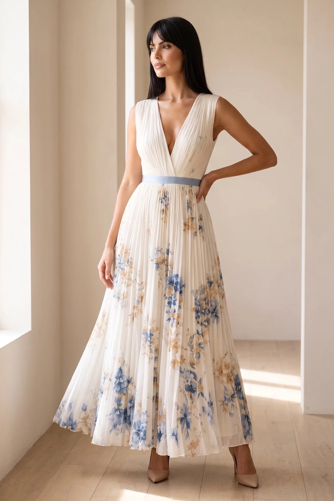 Model wearing beige pleated floral midi dress in lifestyle setting