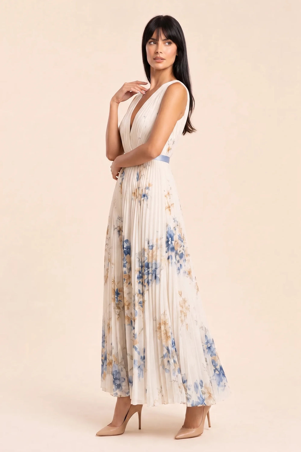 Beige pleated floral midi dress on model in three-quarter turn