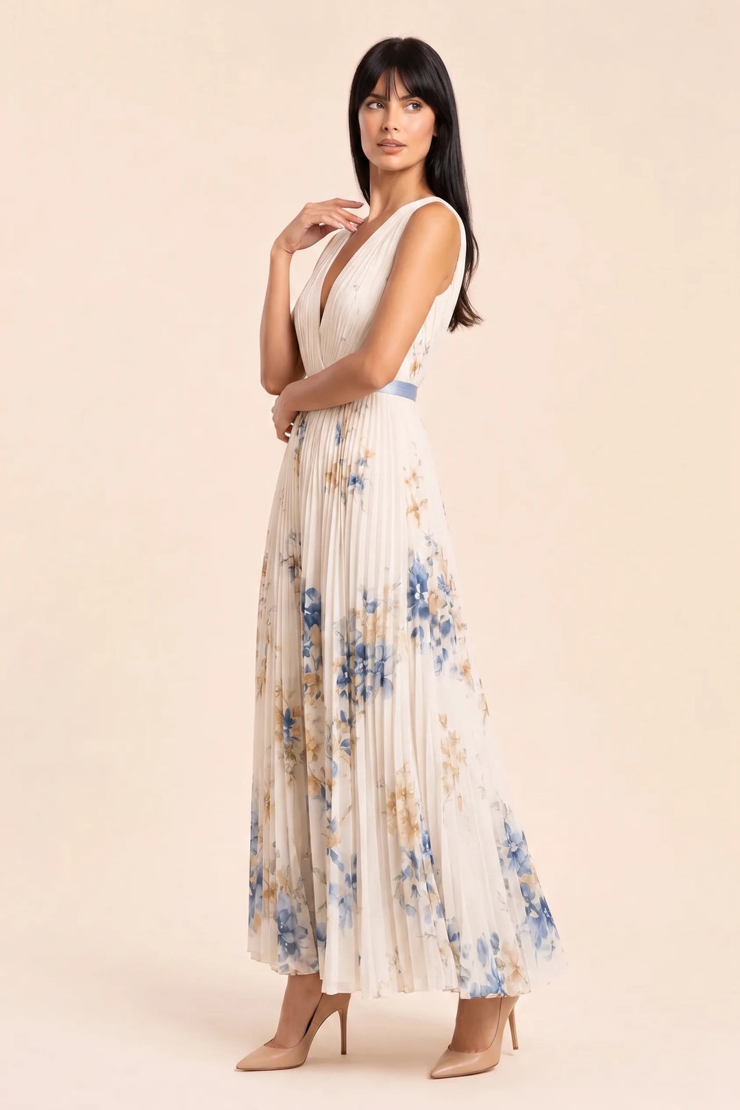 Beige pleated floral midi dress on model in three-quarter turn
