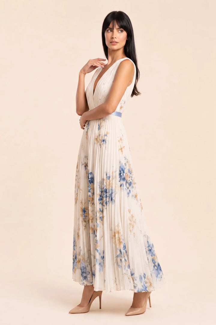 Beige pleated floral midi dress on model in three-quarter turn