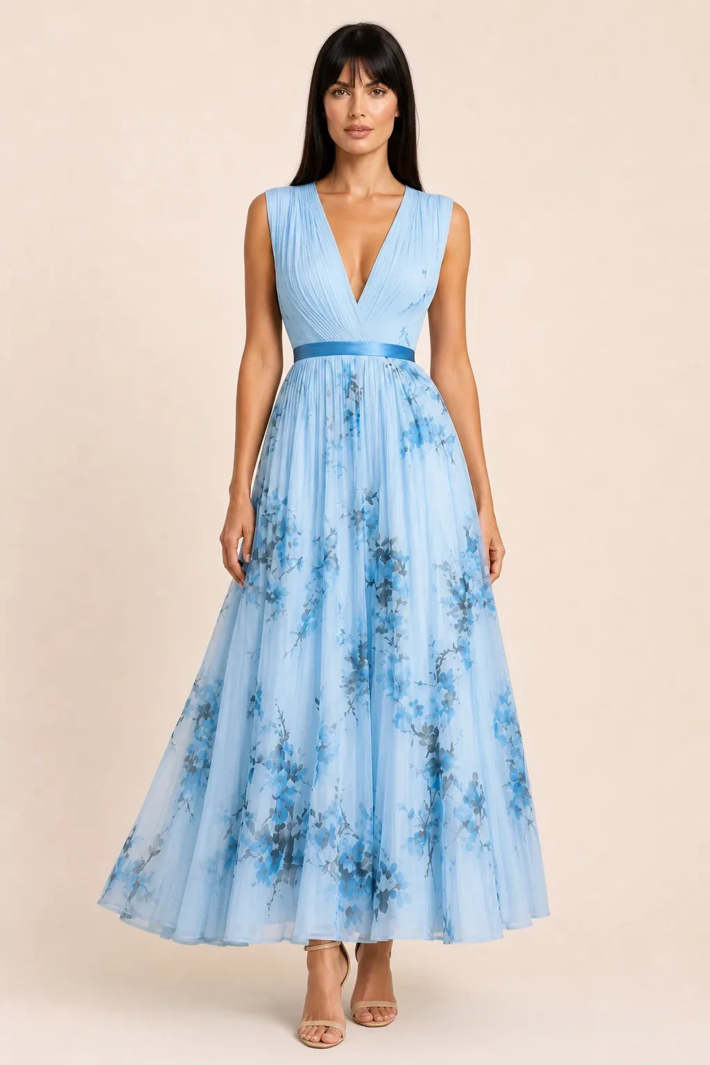 Blue pleated floral midi dress on model in contrapposto stance