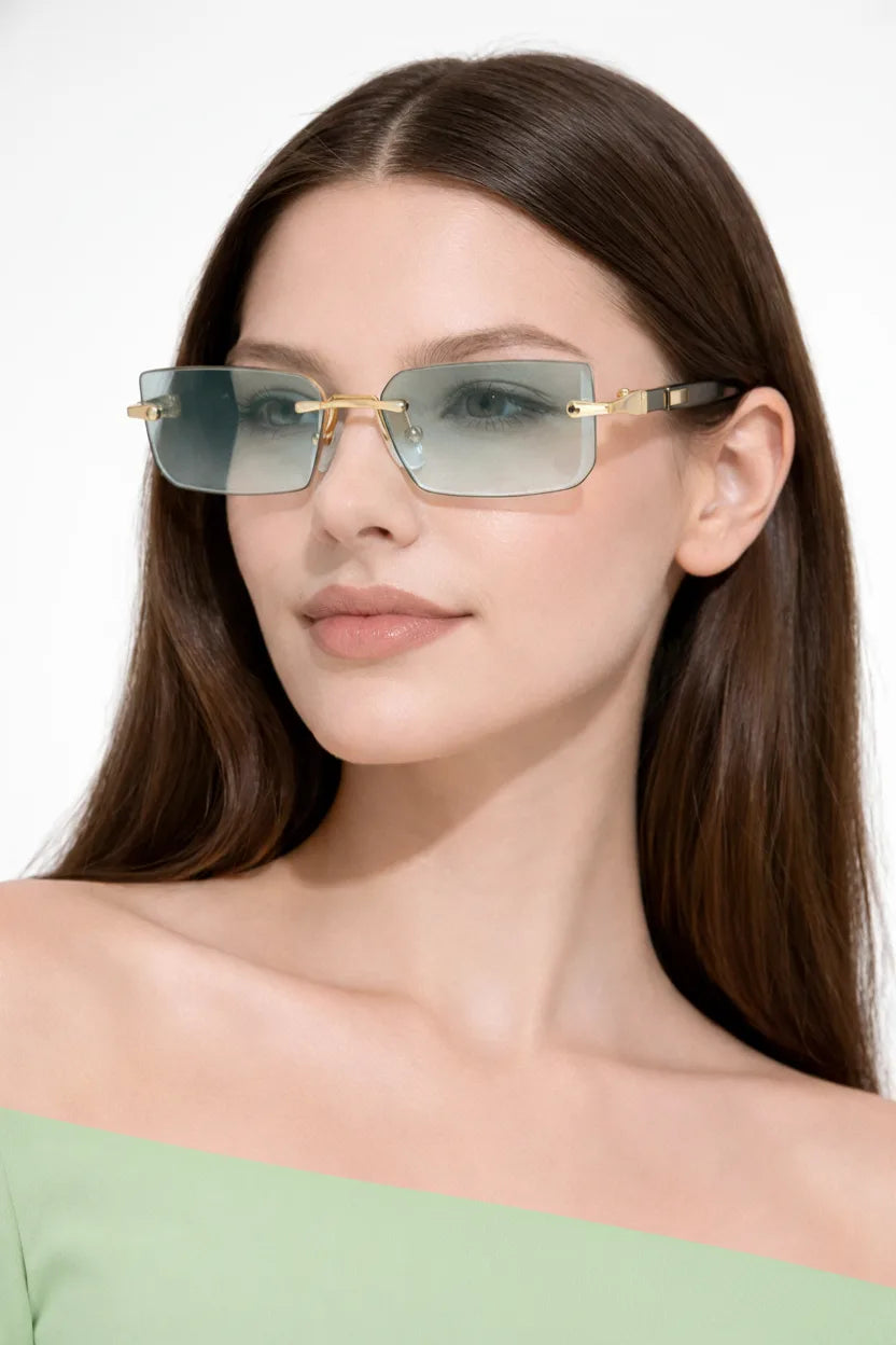 Rimless rectangle gradient sunglasses in light green worn on a model&