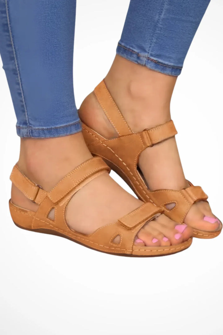 Brown leather sandal with velcro strap closure, front view