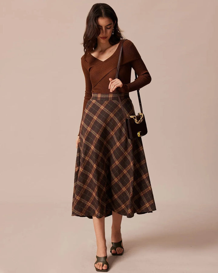 Close-up detail of brown plaid A-line midi skirt fabric and pattern