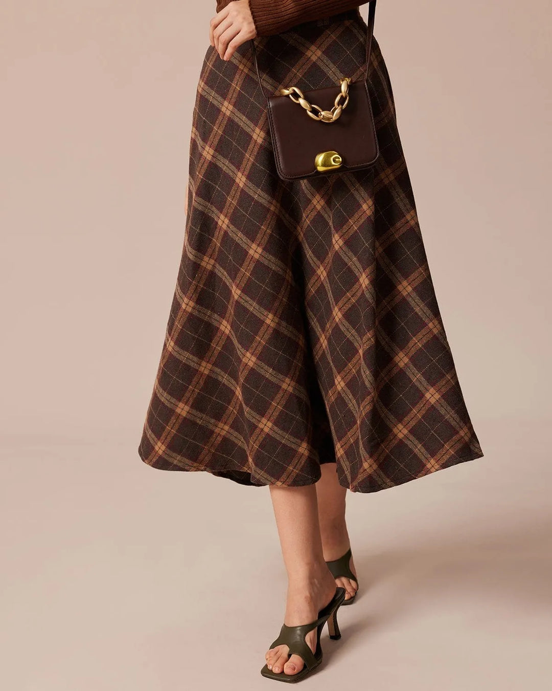 Brown plaid A-line midi skirt, model facing forward