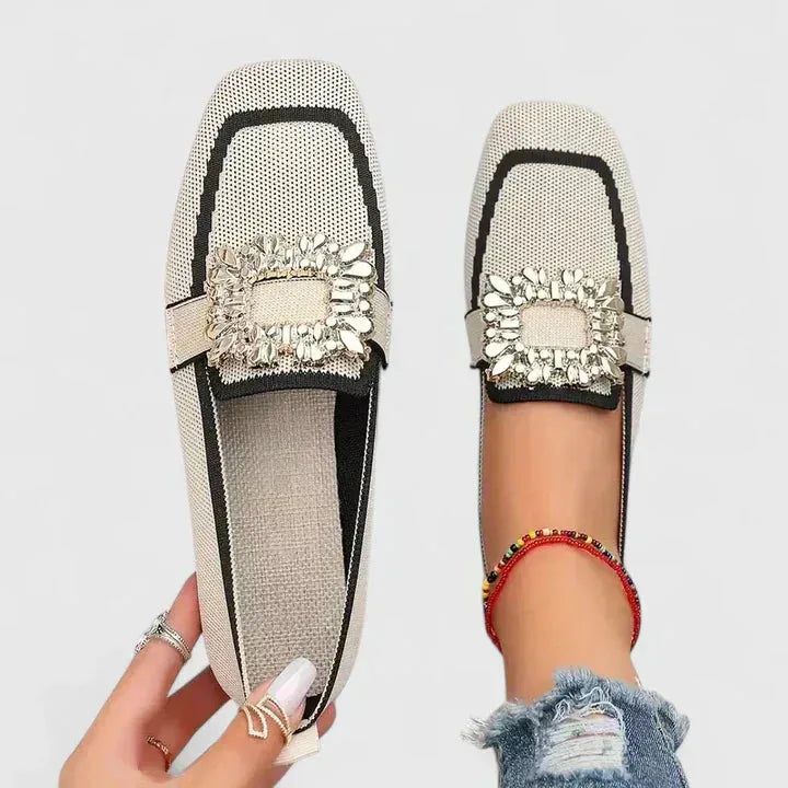 Beige loafer with crystal buckle, three-quarter angle view