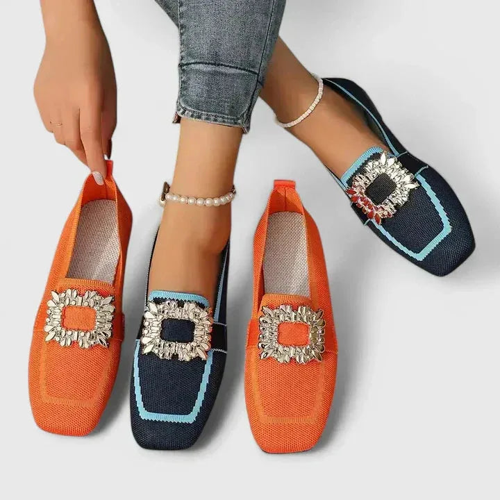 Blue loafer with crystal buckle, styled flat lay view