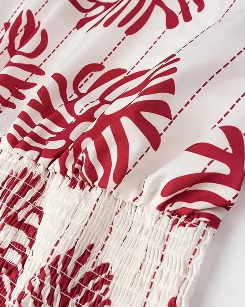 Close-up detail of a white one-shoulder floral mini dress
