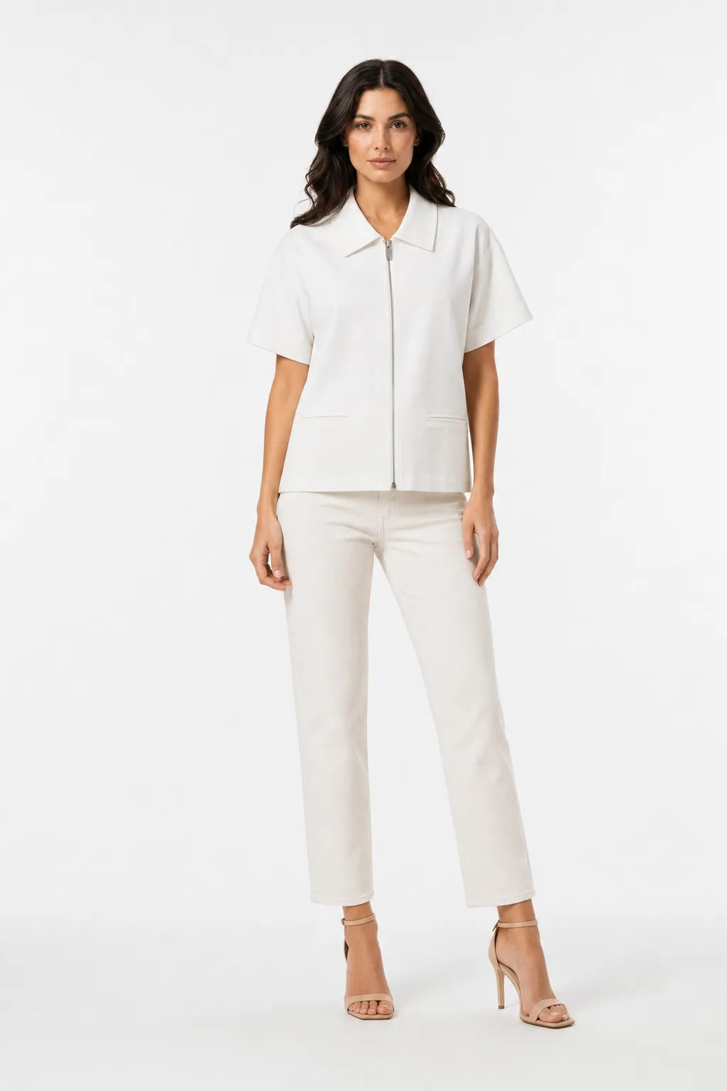 White zip-front jacket on model in contrapposto stance