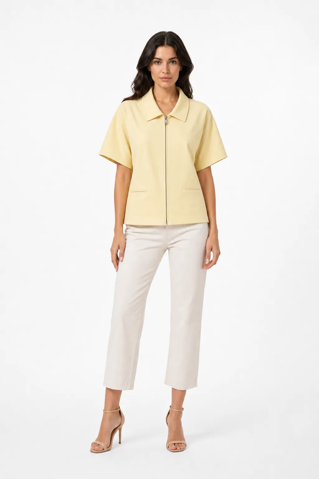 Yellow zip-front jacket on model in contrapposto stance