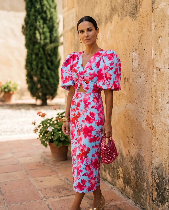 Blue puff sleeve cut-out midi dress, model at three-quarter turn