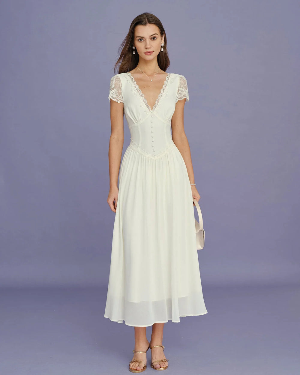 Close-up detail of lace sleeve on apricot midi dress