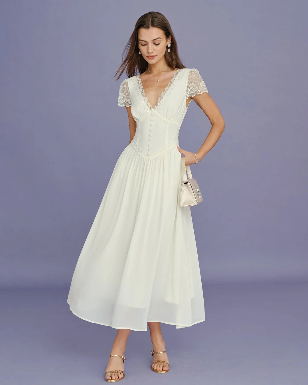 Model facing forward in apricot midi dress with lace sleeves