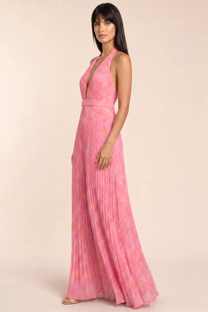 Pink pleated halter gown on model in three-quarter turn