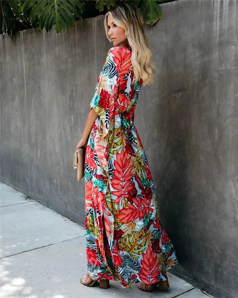 Red tropical-print wrap maxi dress on model, side profile view
