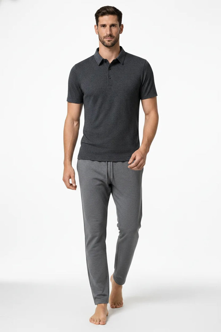 Grey textured knit polo shirt on a model in natural movement
