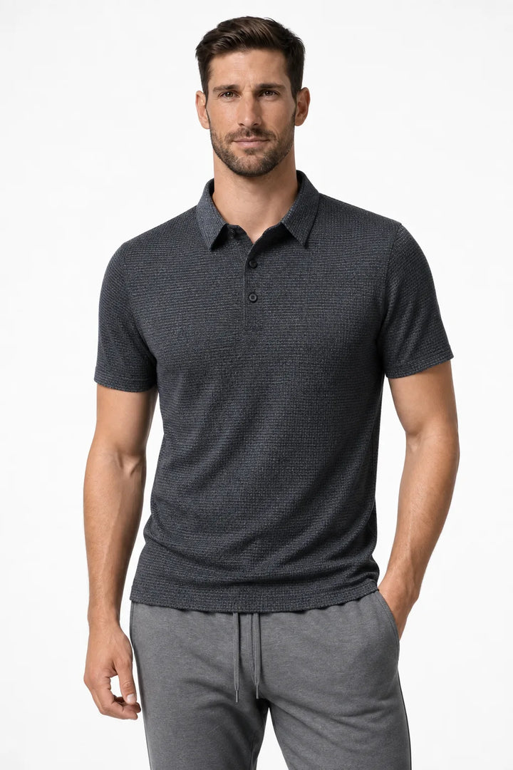Grey textured knit polo shirt on a model in a contrapposto stance