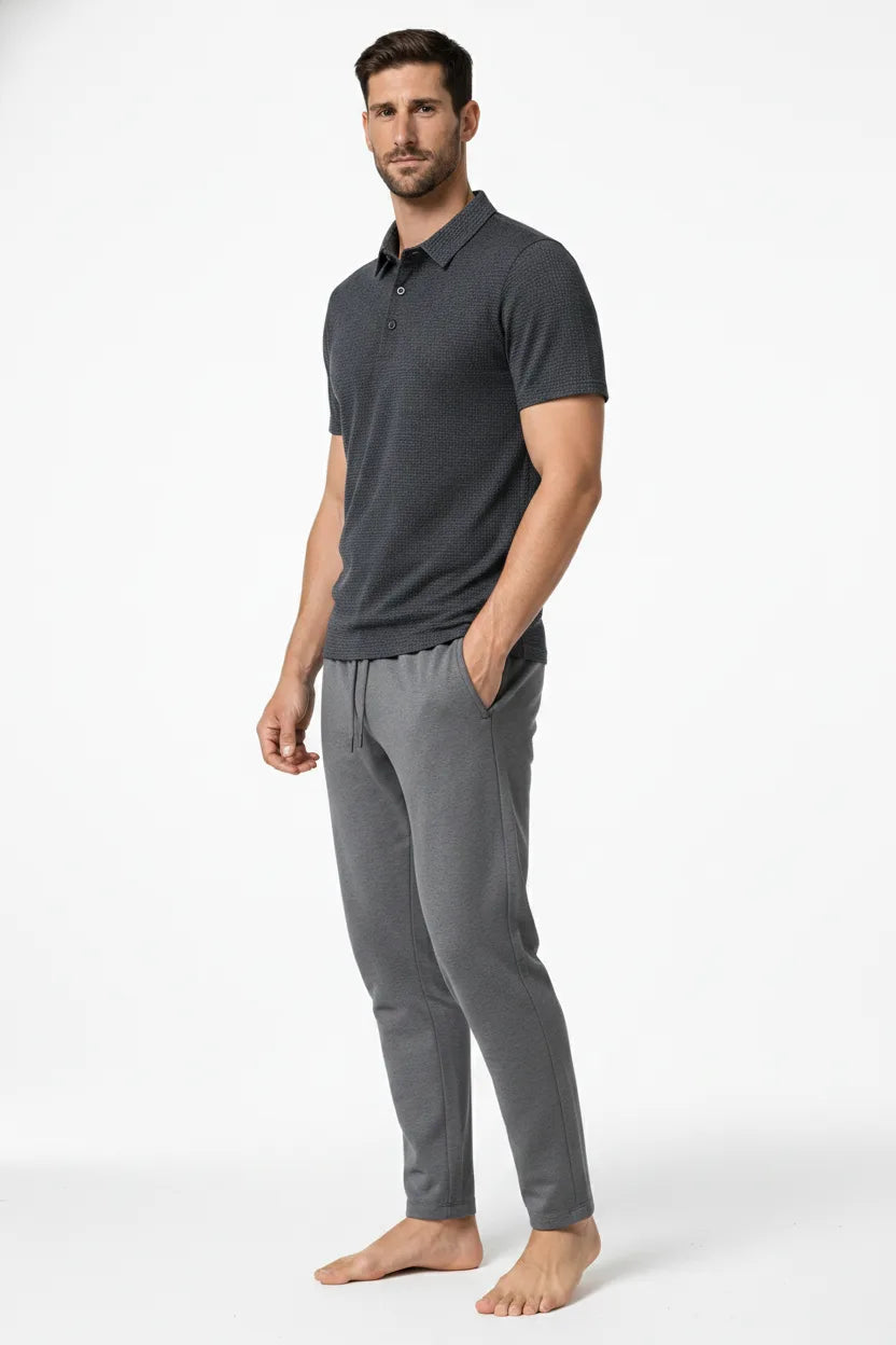 Grey textured knit polo shirt on a model at a three-quarter turn