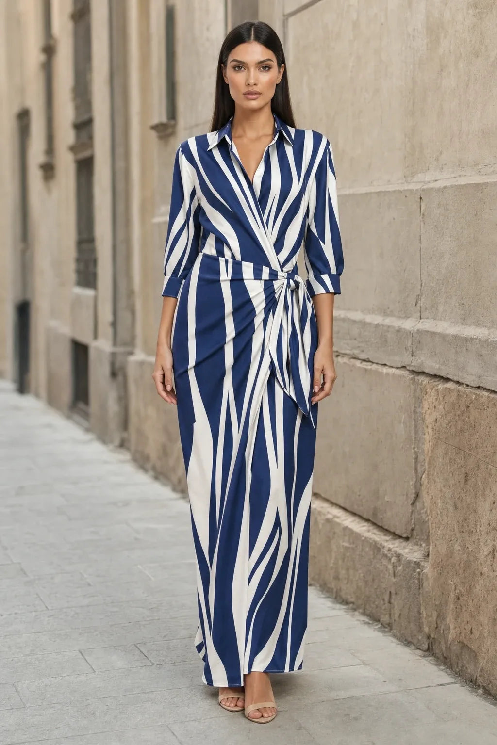 Blue and white wrap knot maxi dress on model in contrapposto stance