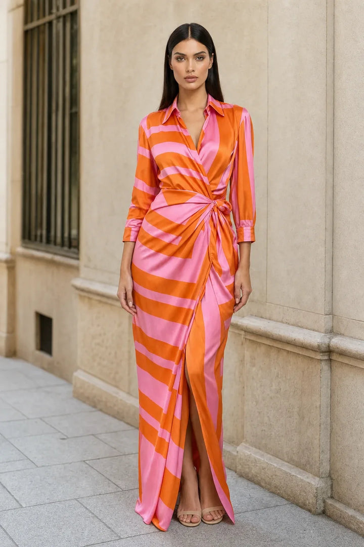 Orange-pink wrap knot maxi dress on model in contrapposto stance