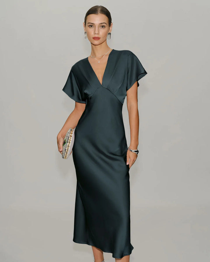 Grey flutter sleeve midi dress on standing model, front view