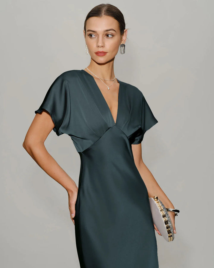 Grey flutter sleeve midi dress on model at three-quarter turn