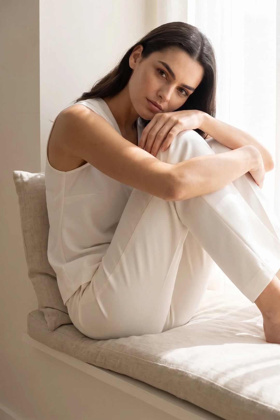 White centre pleat v-neck blouse worn in an outdoor lifestyle setting