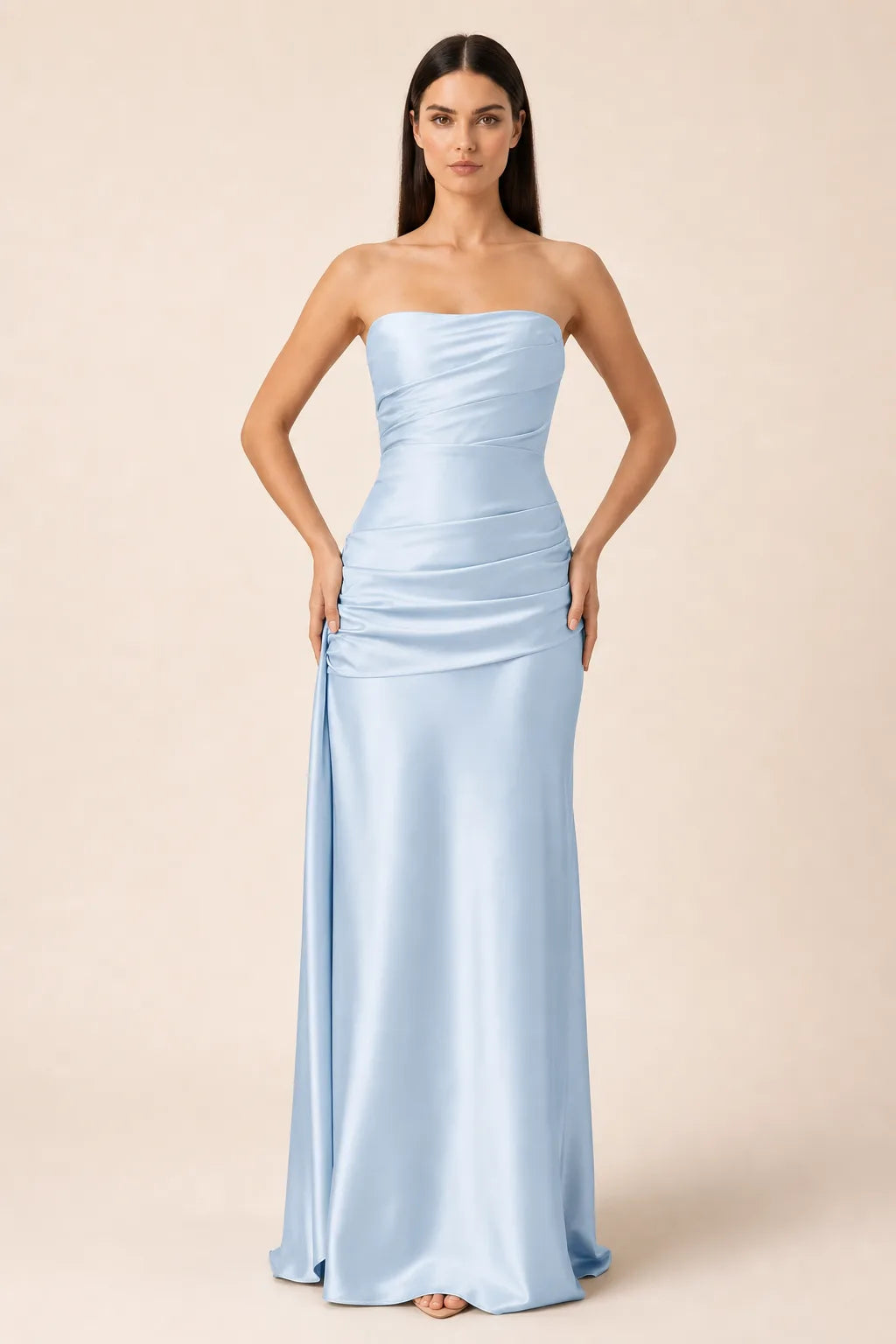 Light blue ruched satin gown with gathered bodice and floor-length skirt, model in contrapposto stance