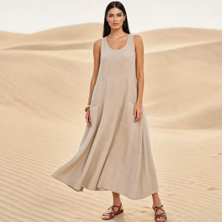 Khaki maxi dress with side pockets, model standing in contrapposto pose