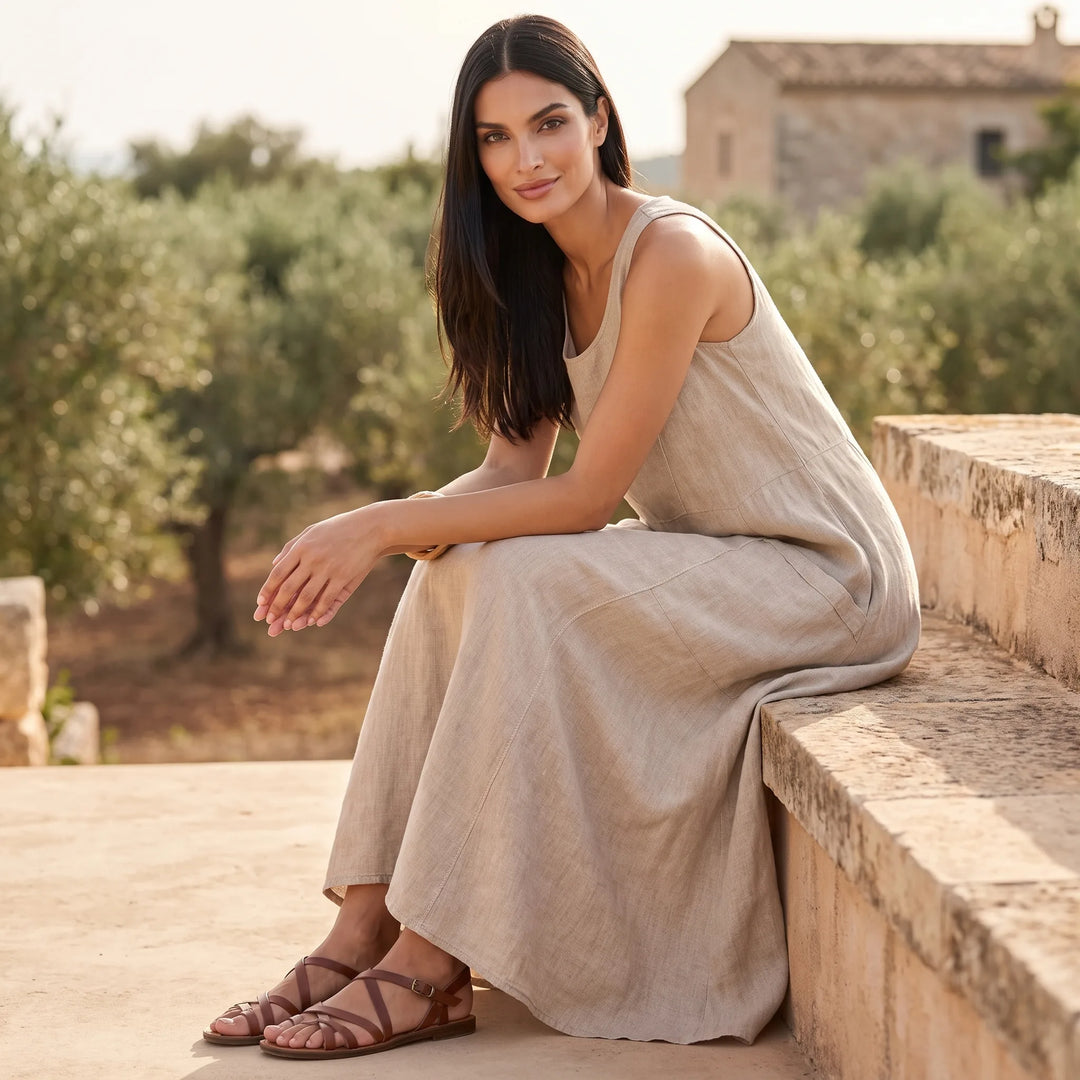 Model wearing khaki maxi dress in an outdoor lifestyle setting