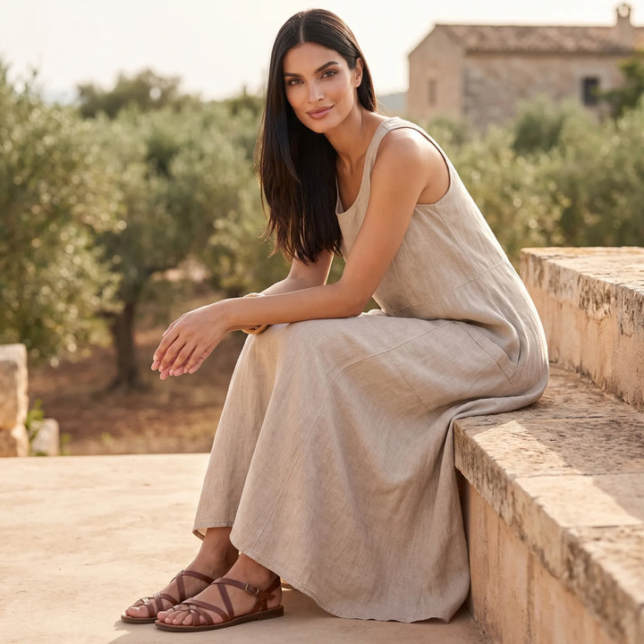 Model wearing khaki maxi dress in an outdoor lifestyle setting
