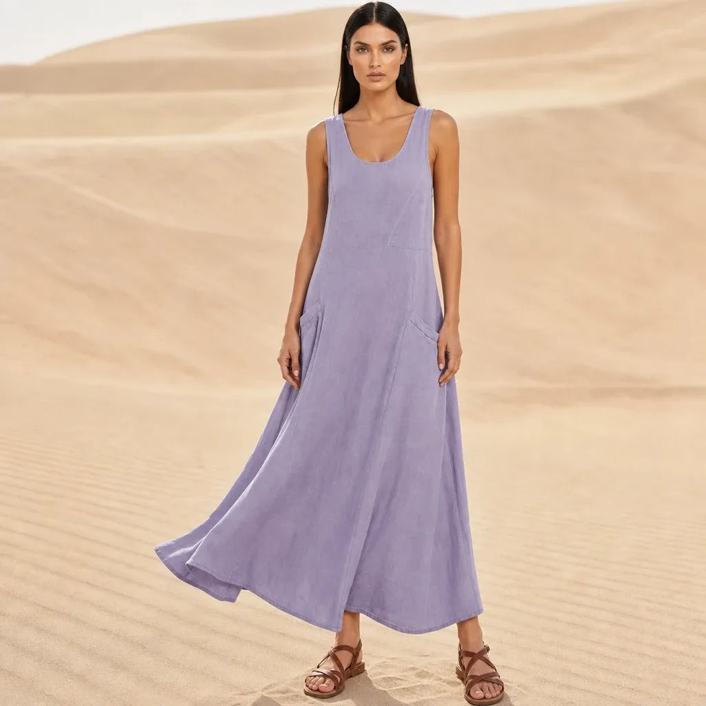 Purple maxi dress with side pockets, model standing in contrapposto pose
