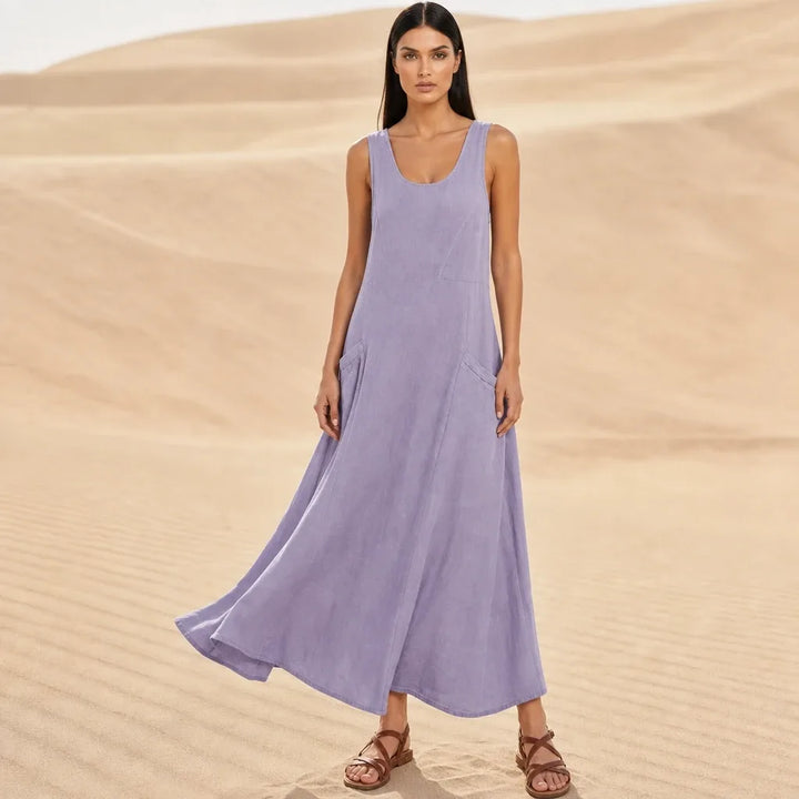 Purple maxi dress with side pockets, model standing in contrapposto pose