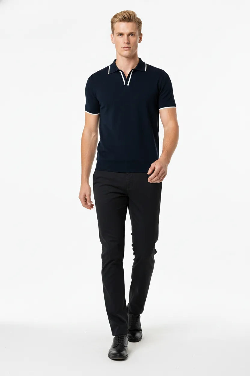 Navy blue knit polo with contrast trim, model in natural movement