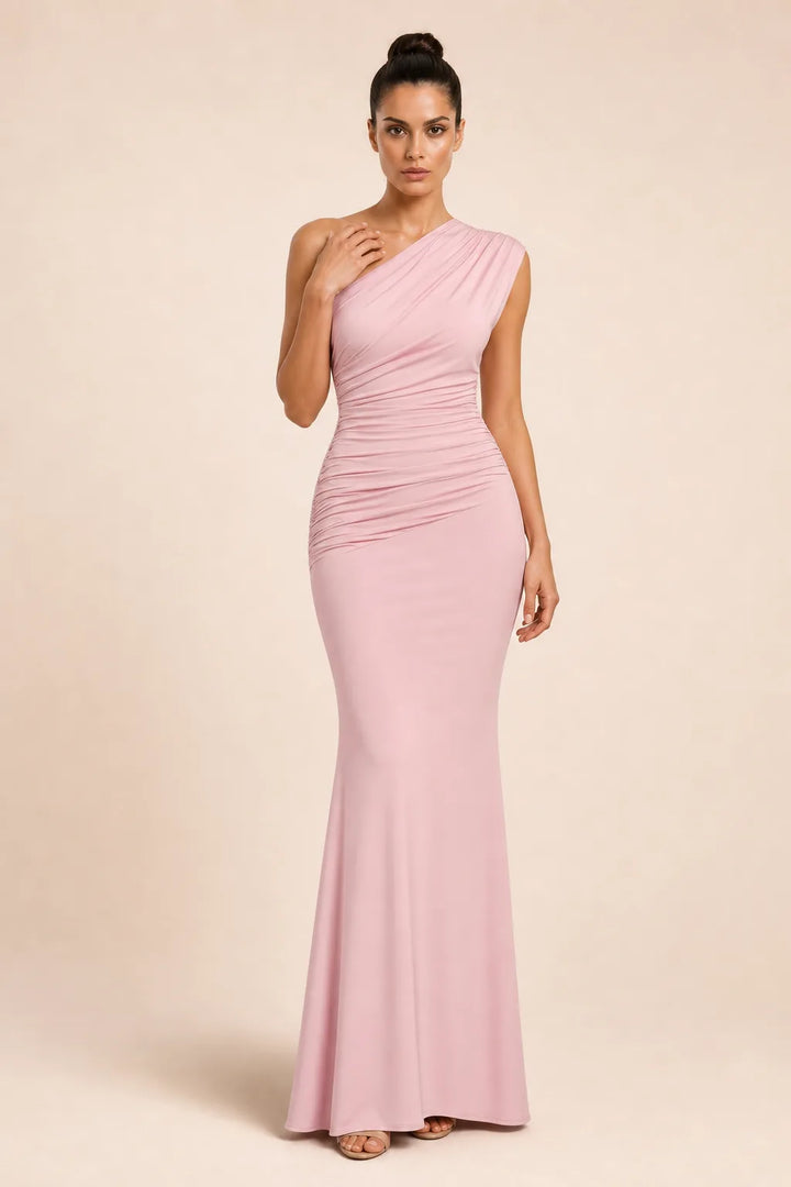 Floor-length pink one-shoulder gown on a model in a contrapposto stance