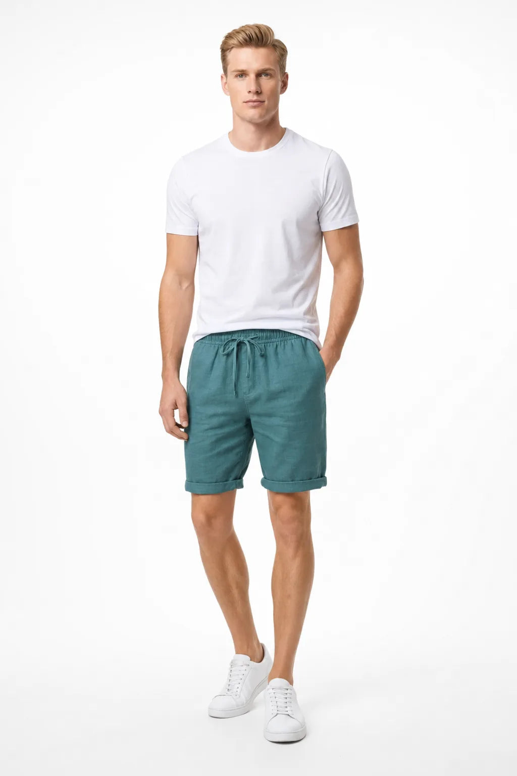 Green linen drawstring shorts on a model in a contrapposto stance