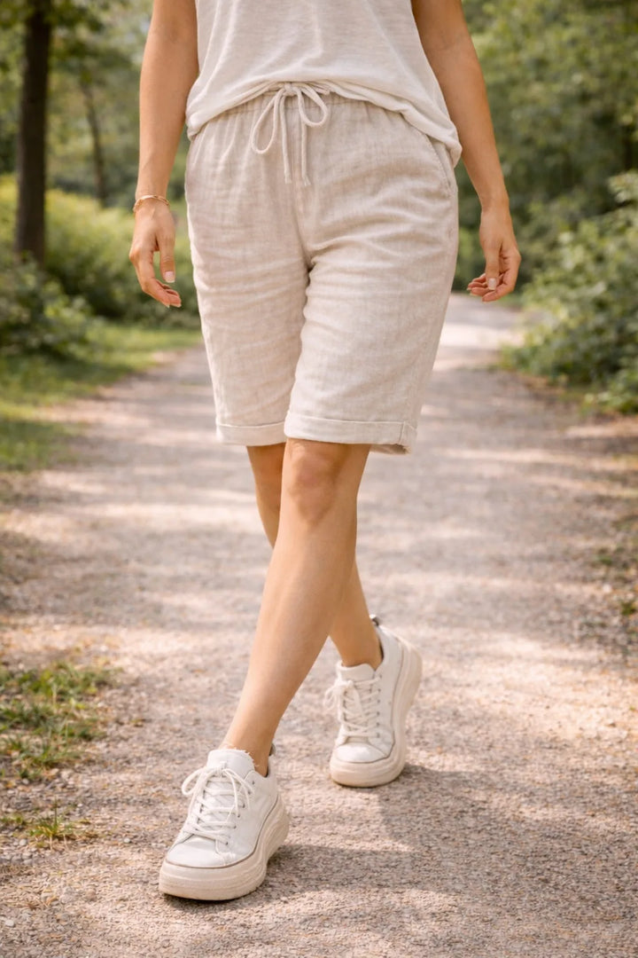 Close-up detail of drawstring waistband on Bermuda shorts