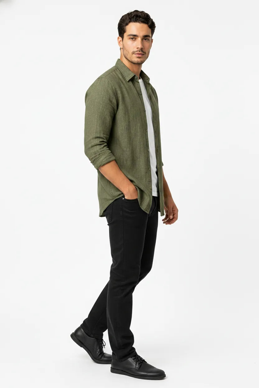 Green linen relaxed overshirt on male model in three-quarter turn